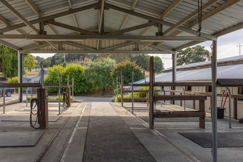 Open barn breezeway looking toward the hills beyond the farm