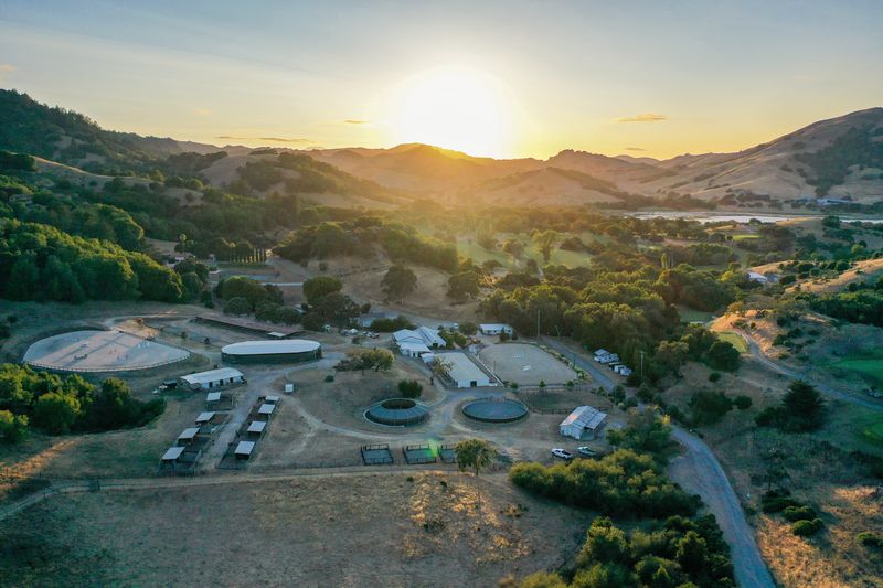 Hindsight Farms at sunset with the surrounding Marin hills and reservoir